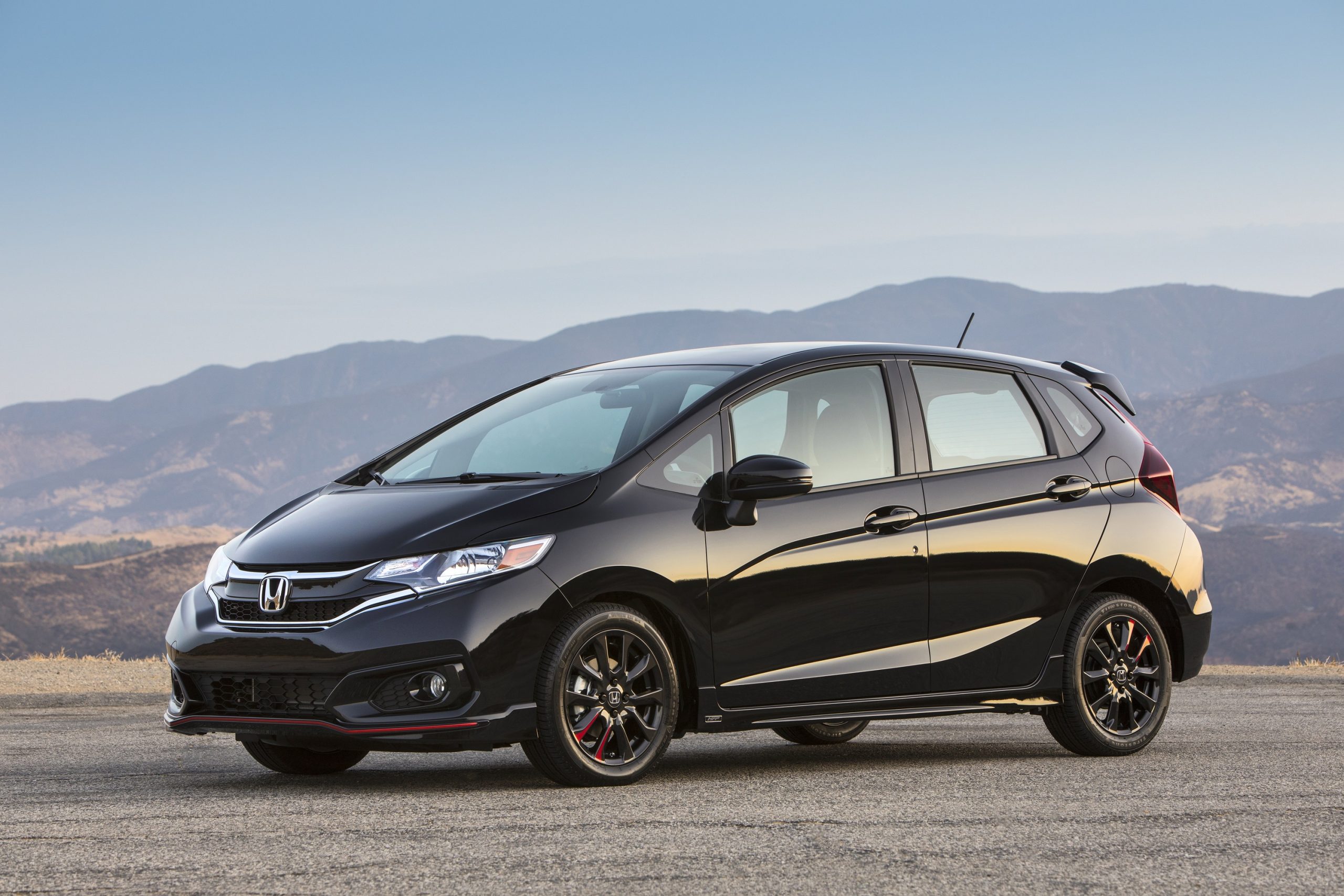 A black Honda fit, the Chevy Spark's closest competitor, shot from the 3/4 angle