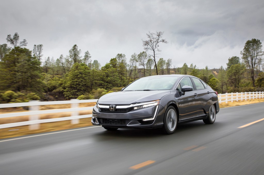 2021 Honda Clarity Plug-In Hybrid driving down a road