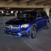 A Galaxy Blue 2021 Mercedes-Benz GLB 250 SUV shot from the front 3/4