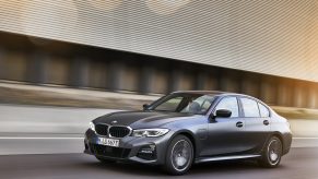 A silver 2022 BMW 3 Series hybrid shot from the front 3/4