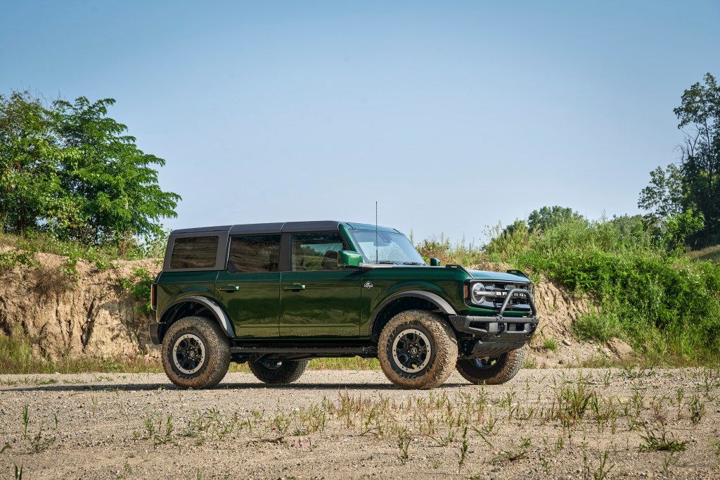 2022 Ford Bronco in Eruption Green from the sider, dealer markups are prioritized over reservation holders
