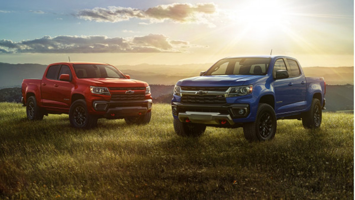 A pair of 2022 Chevrolet Colorado Trucks in a Field