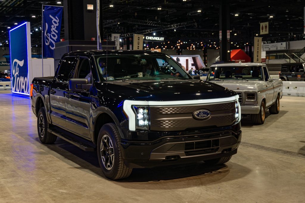 A black 2022 Ford F-150 Lightning at the 2022 Chicago Auto Show