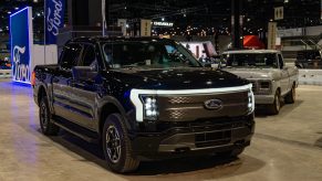A black 2022 Ford F-150 Lightning at the 2022 Chicago Auto Show