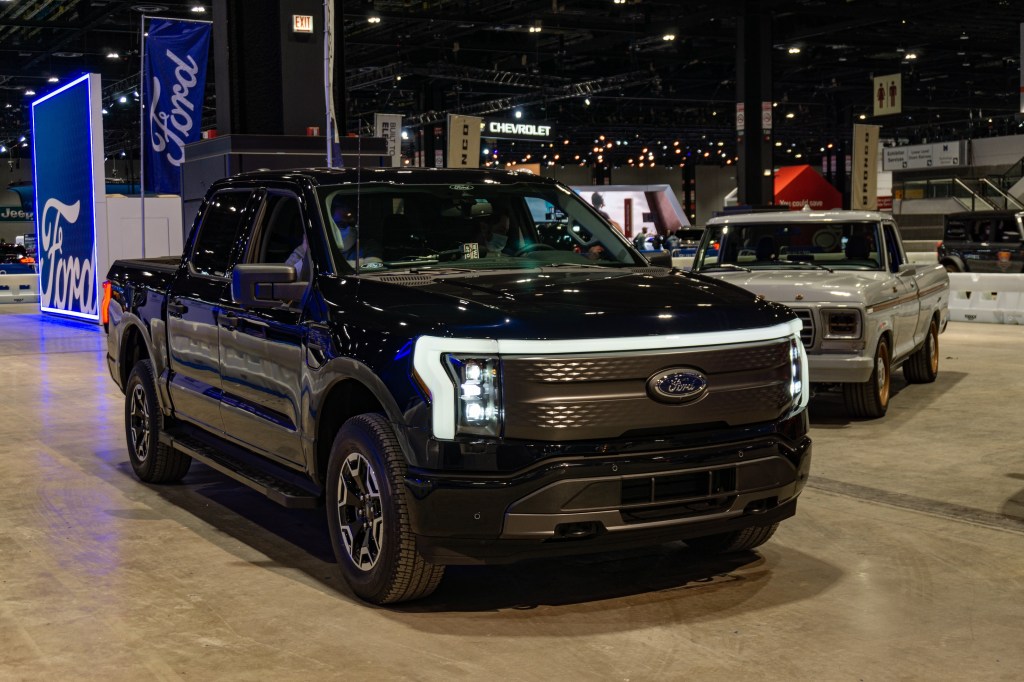 A black 2022 Ford F-150 Lightning at the 2022 Chicago Auto Show