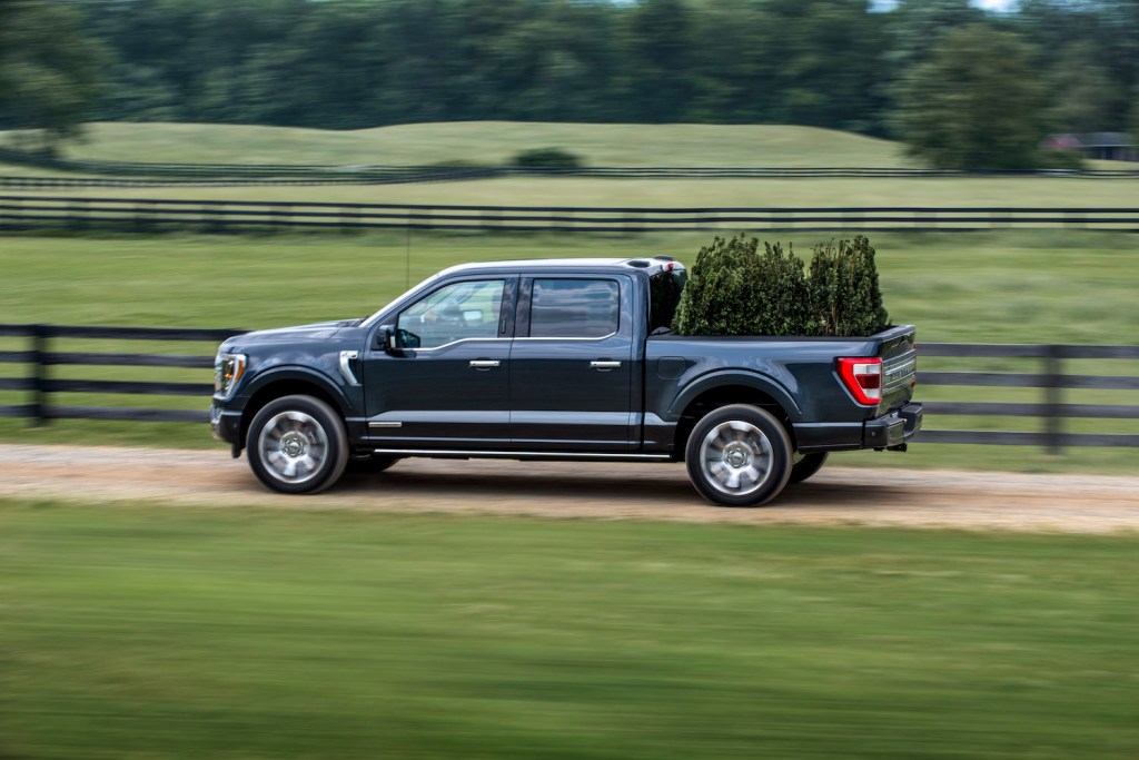 This is a gray 2022 Ford F-150 Limited pickup truck powered by a PowerBoost hybrid engine.
