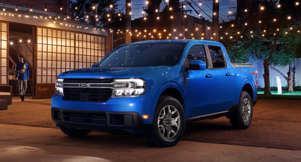 A blue 2022 Ford Maverick small pickup truck is parked outside.
