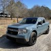 The 2022 Ford Maverick First Edition on a gravel road