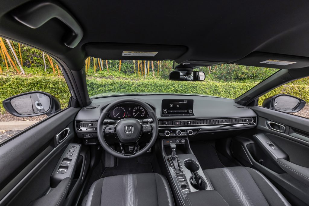 The black front seats and dashboard of a 2022 Honda Civic Sedan Sport
