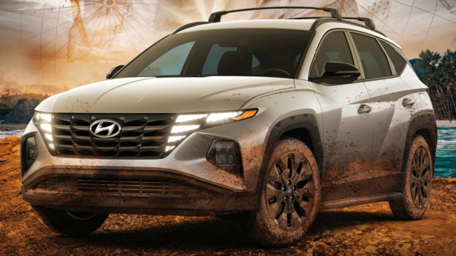 A gray 2022 Hyundai Tucson XRT on an 'Uncharted' movie poster.