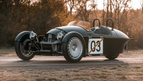 A dark-green 2022 Morgan Super 3 on a winter road