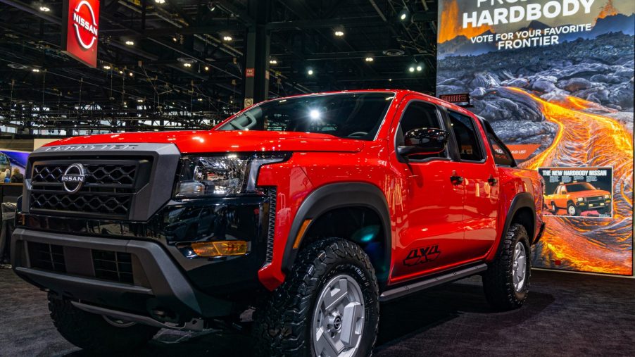 The front 3/4 view of the red-and-black 2022 Nissan Frontier Project Hardbody at the 2022 Chicago Auto Show