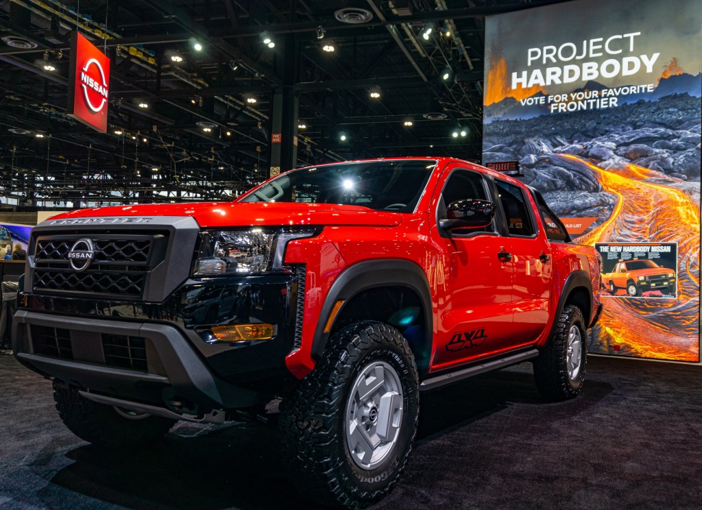 The front 3/4 view of the red-and-black 2022 Nissan Frontier Project Hardbody at the 2022 Chicago Auto Show