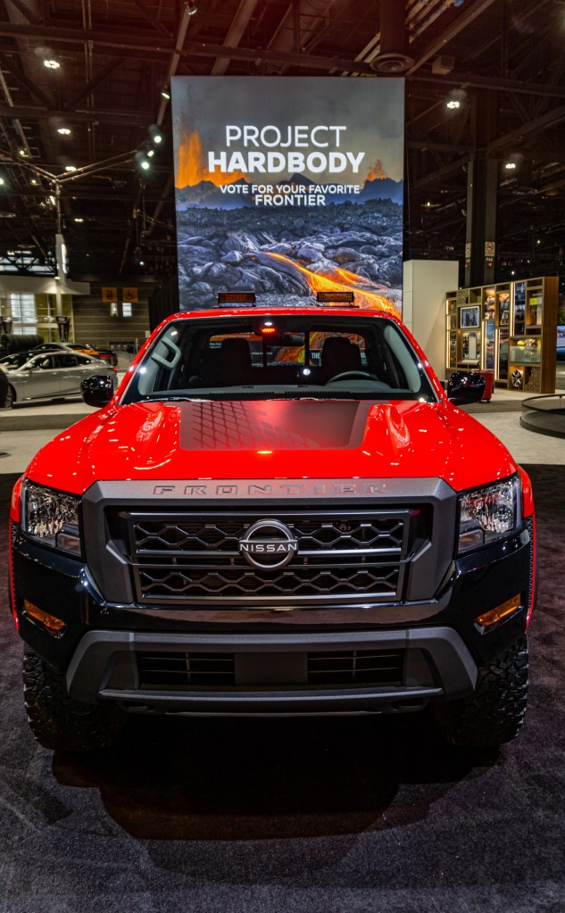The front view of the red-and-black 2022 Nissan Frontier Project Hardbody at the Chicago Auto Show