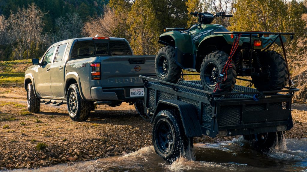 A 2022 Nissan Frontier towing an ATV on a trailer. Which trim level is the best?