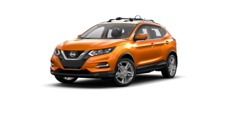 An orange 2022 Nissan Rogue Sport against a white background.