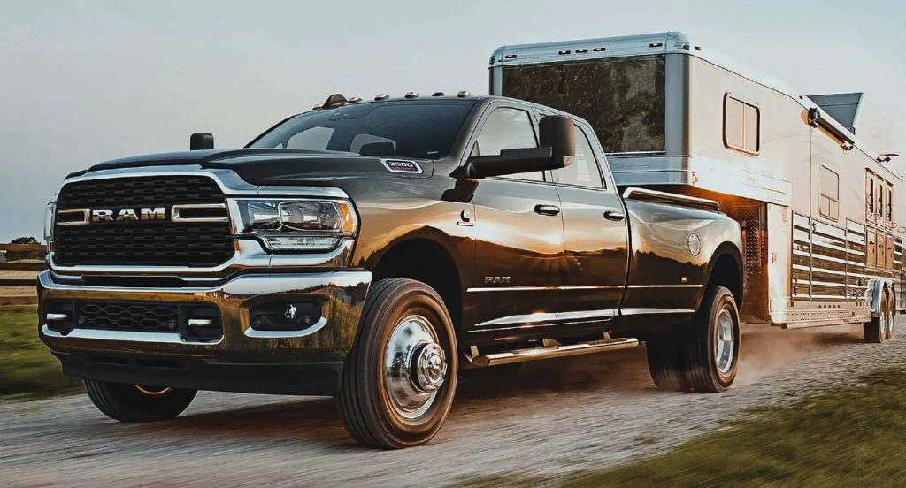 A black Ram 2500 is towing a trailer. 