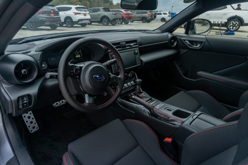 The black interior of a 2022 Subaru BRZ Premium at a racetrack