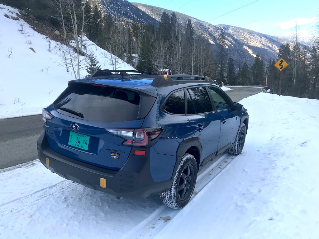  2022 Subaru Outback Wilderness rear shot in the snow for our full review
