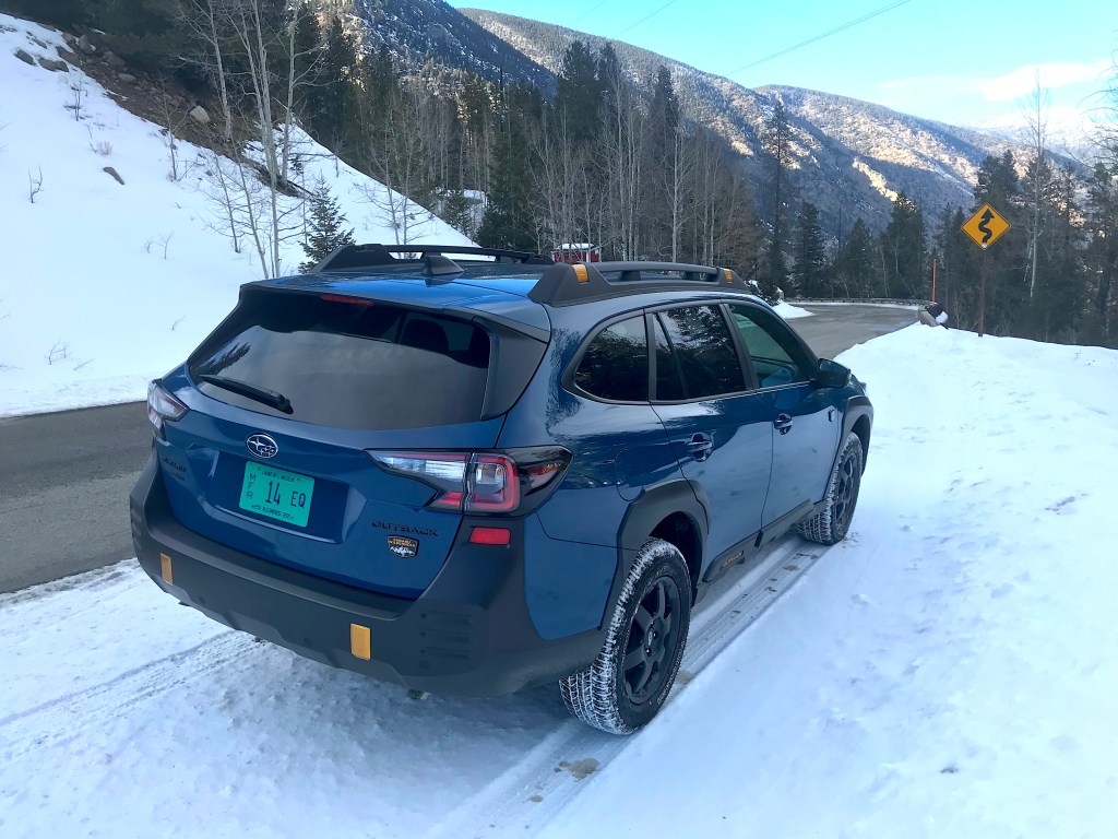 2022 Subaru Outback Wilderness rear shot in the snow for our full review