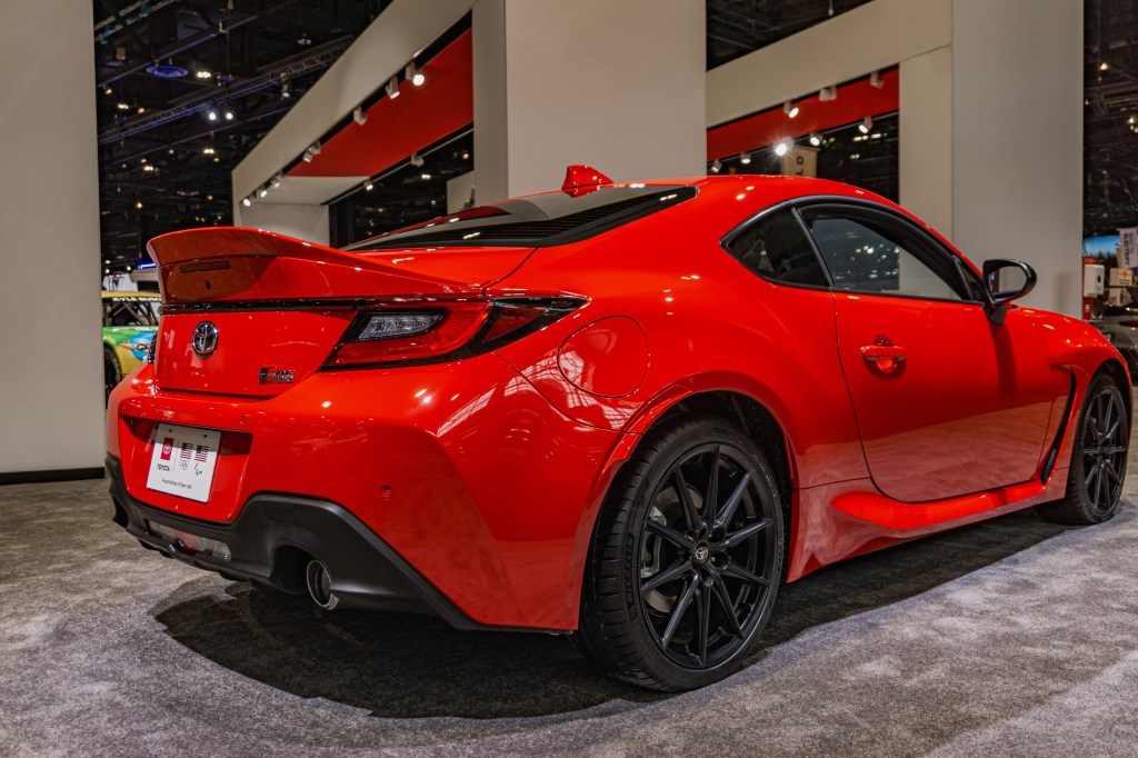 The rear 3/4 view of a red 2022 Toyota GR86 Premium at the 2022 Chicago Auto Show