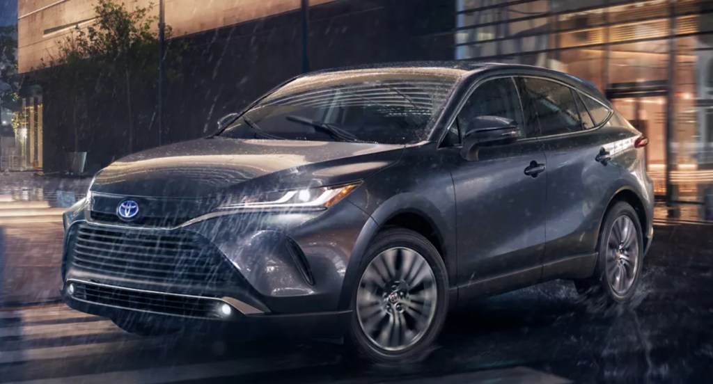 A gray 2022 Toyota Venza is driving in the rain. 