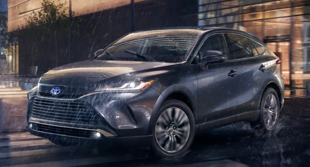 A gray 2022 Toyota Venza is driving in the rain.
