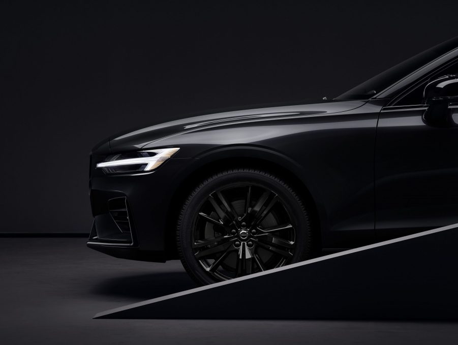 A close-up look at a black 2022 Volvo S60 Black Edition's front wheel