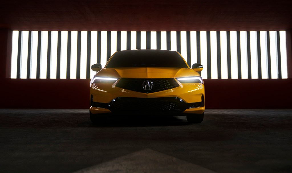 A front shot of the 2023 Acura Integra in yellow