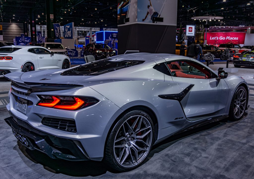 The rear 3/4 view of a blue-silver 2023 C8 Chevrolet Corvette Z06 Coupe at the Chicago Auto Show