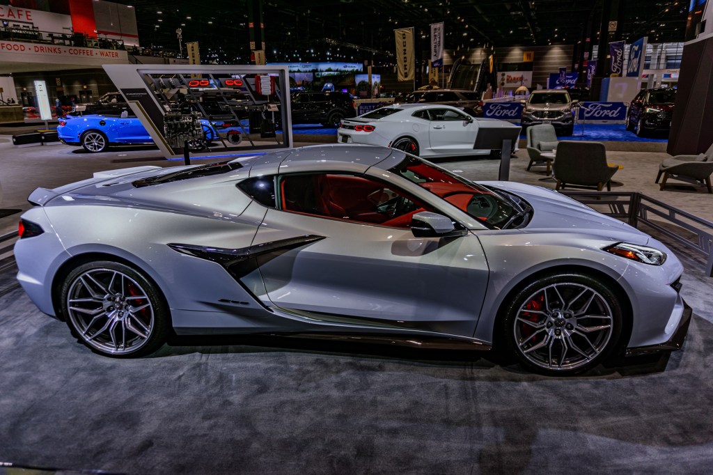 The side view of a blue-silver 2023 C8 Chevrolet Corvette Z06 3LZ Coupe at the Chicago Auto Show