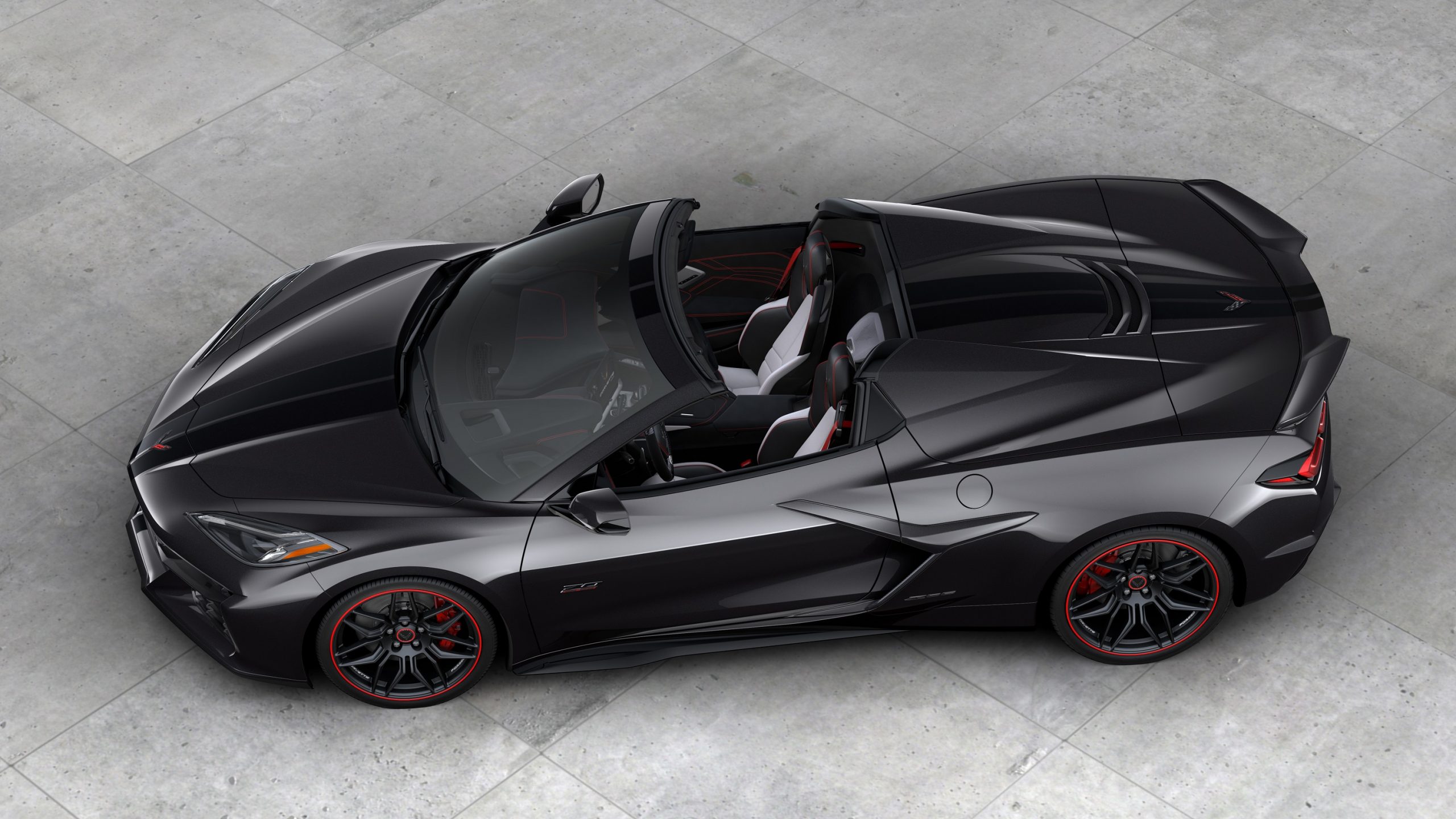 A black Z06 shot from a high profile angle with the roof off