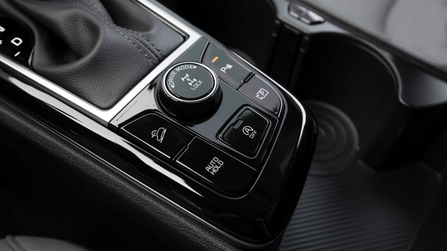 2023 Kia Sportage X-Pro transmission with driving mode option dial and buttons