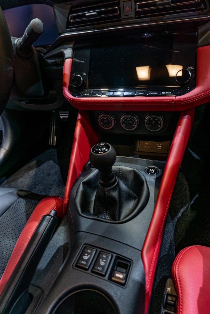 The red-and-black-leather-trimmed center console of a 2023 Nissan Z Performance