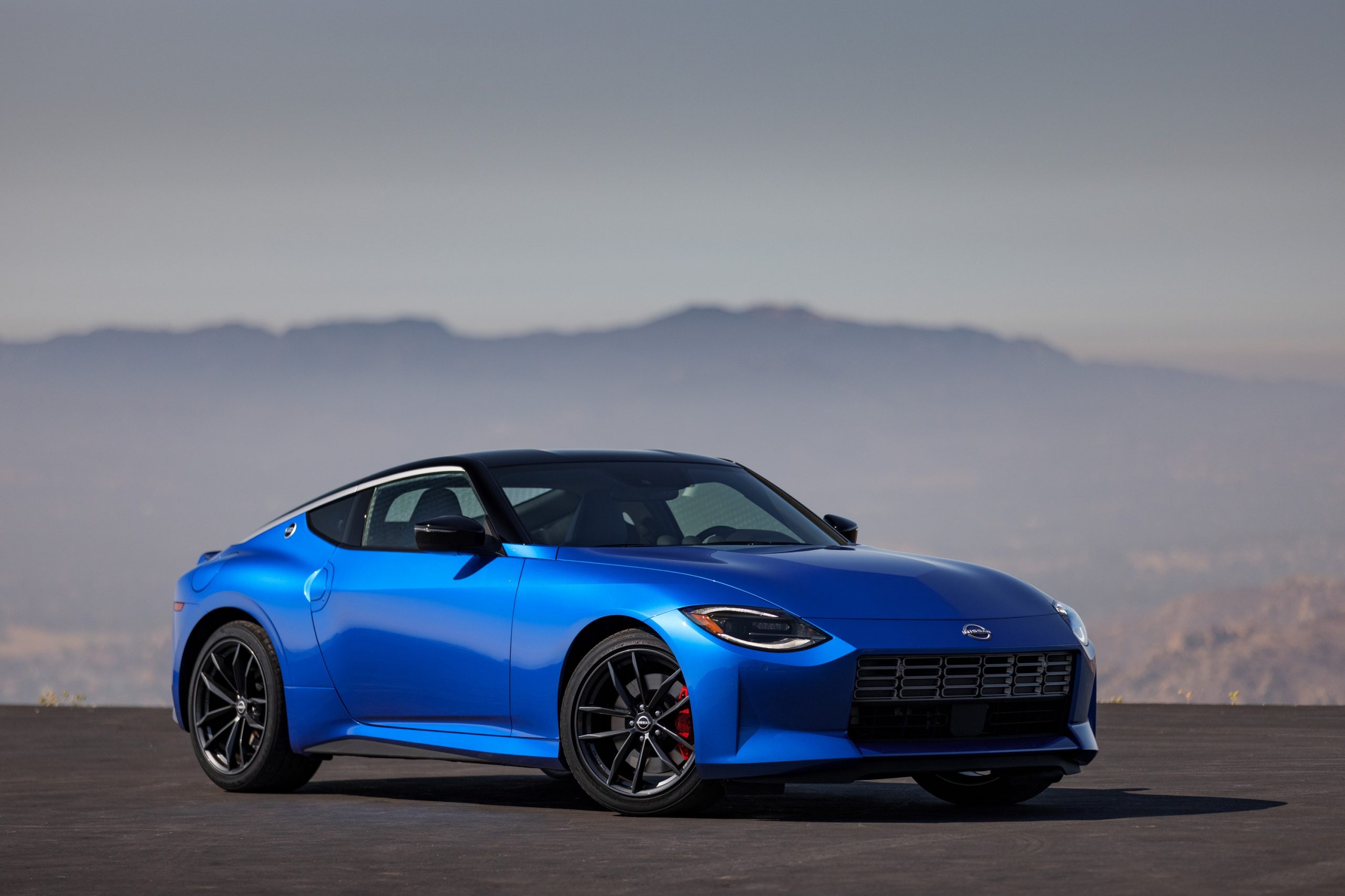 A blue 2023 Nissan Z shot from the front 3/4 in the Angeles Forest