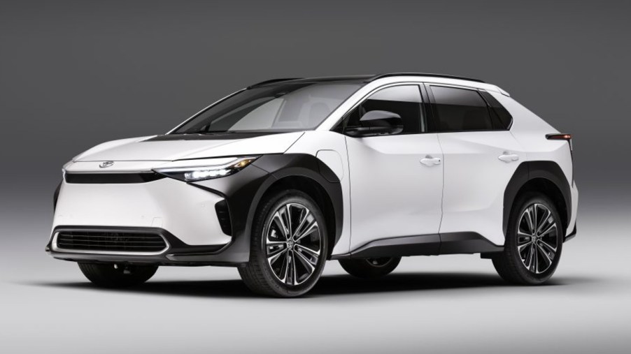 A white 2023 Toyota bZ4X electric SUV is on display.