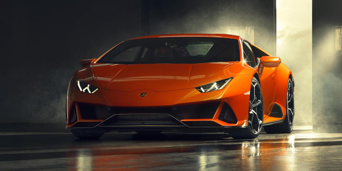 A front view of an orange Lamborghini Huracan EVO.