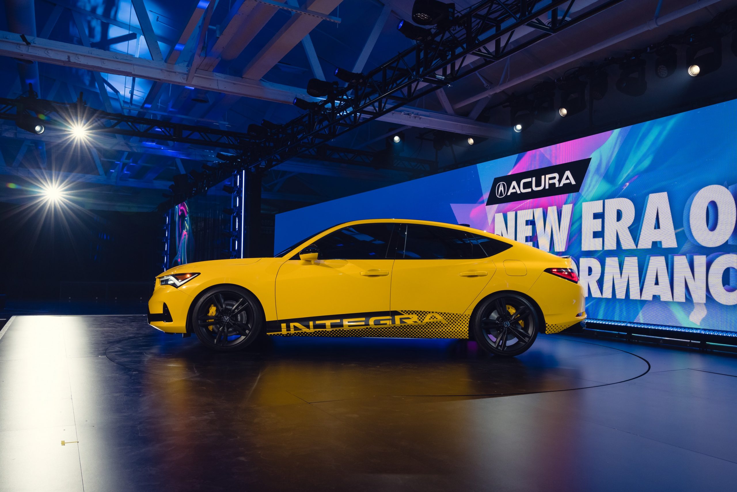 A profile shot of the new Integra in yellow