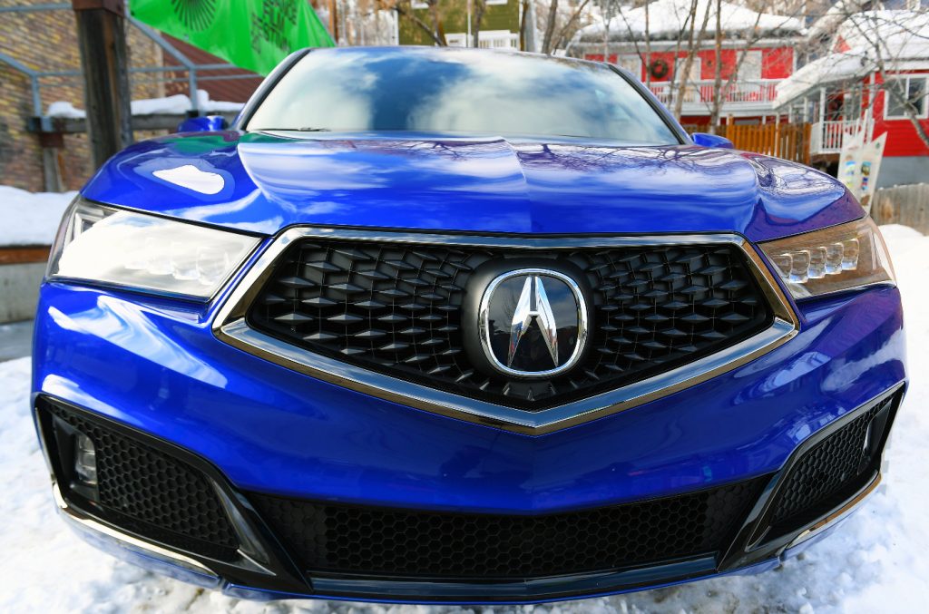 The Acura MDX shows off its sharp design as a luxury SUV.