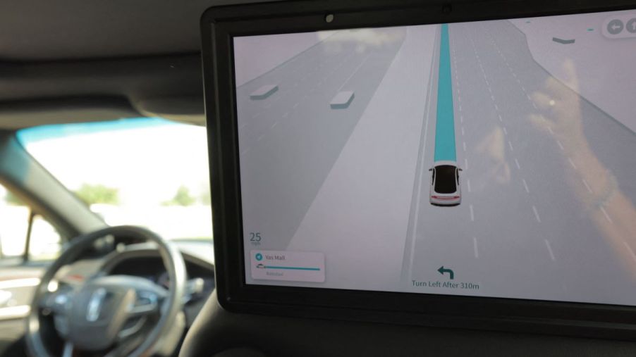 A screen in a potentially self-driving / autonomous vehicle from the backseat.