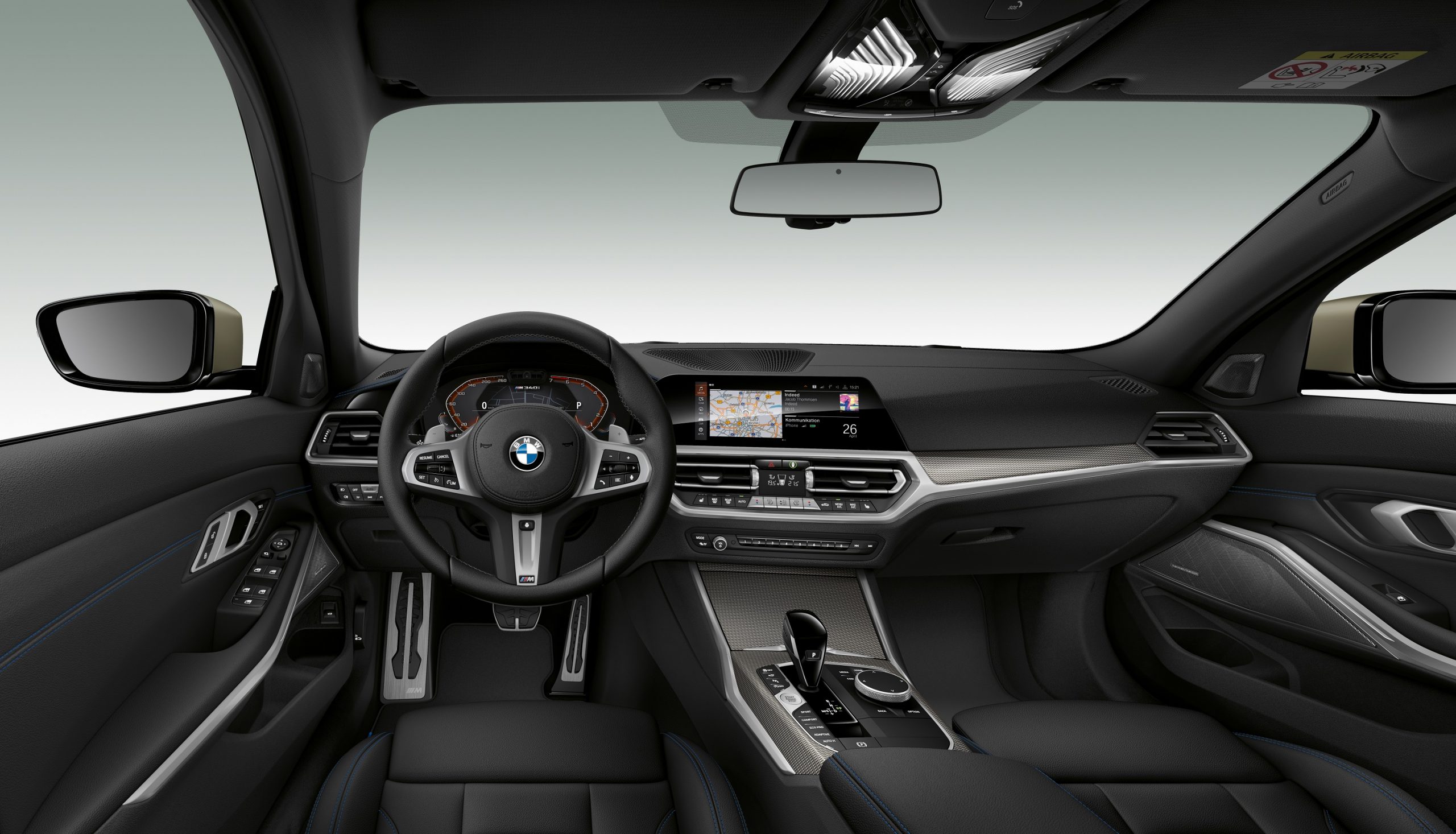 The 2022 BMW 3 Series interior with chrome trim and black leather