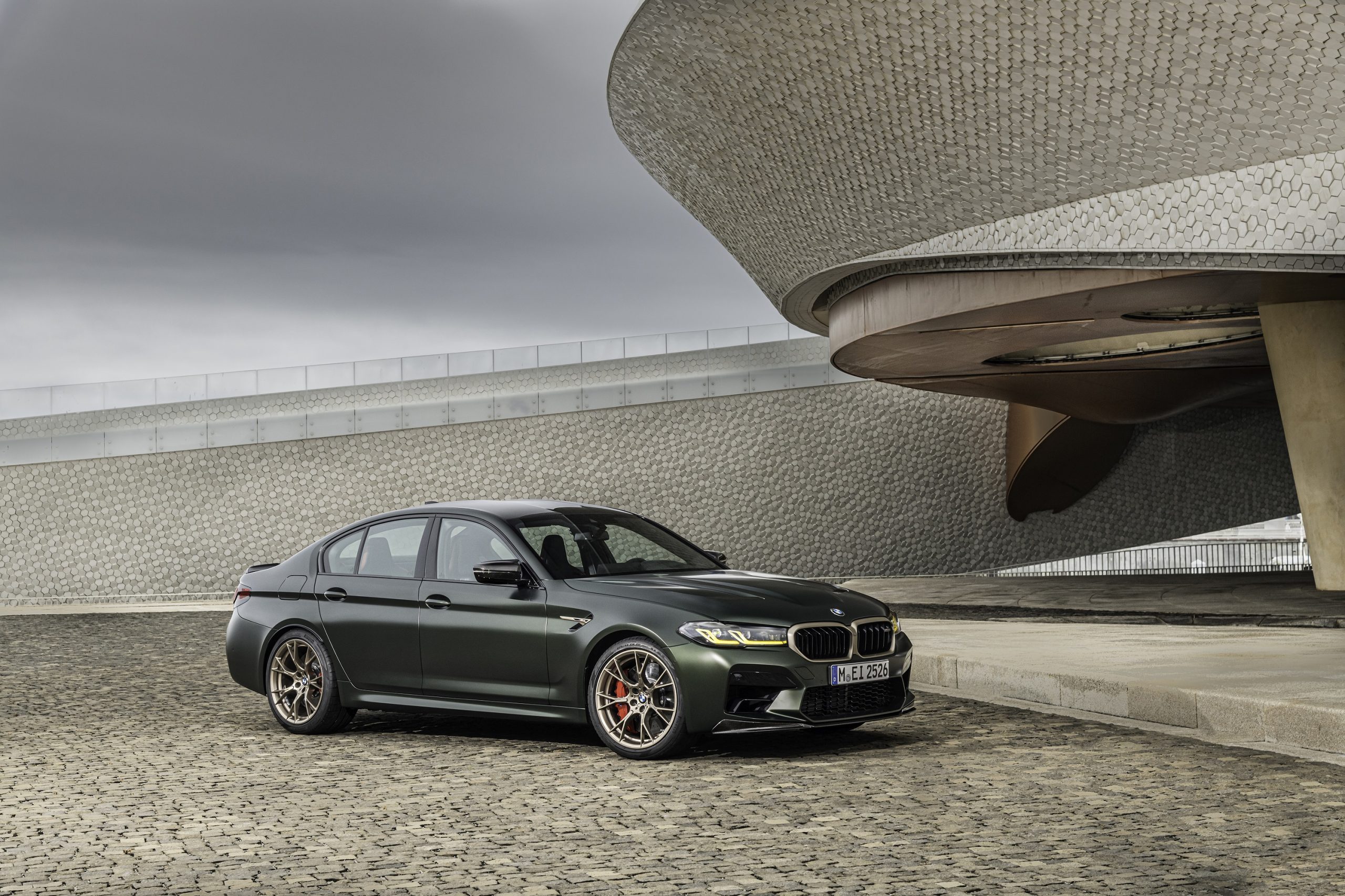 A dark green BMW M5 CS shot from the front 3/4