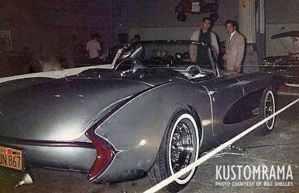 The rear view of the purple 'Bali Hi' 1957 Chevrolet Corvette at a car show