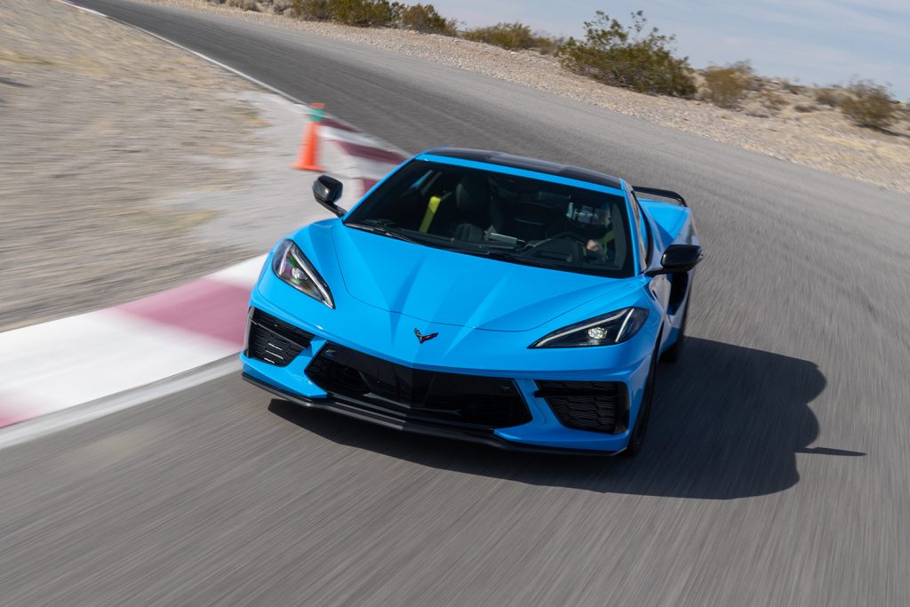 Chevrolet C8 Corvette Stingray in rapid blue on race track shot from front end