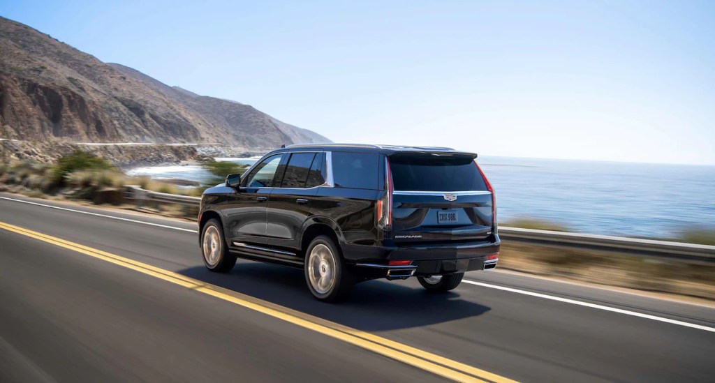The 2022 Cadillac Escalade shows itself as a luxury SUV, cruising the coast.