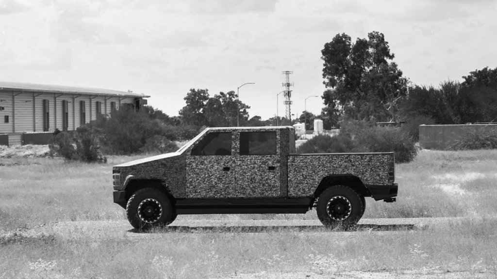 Camouflaged Altis XT parked in a field, highlighting how it could be the best electric pickup truck