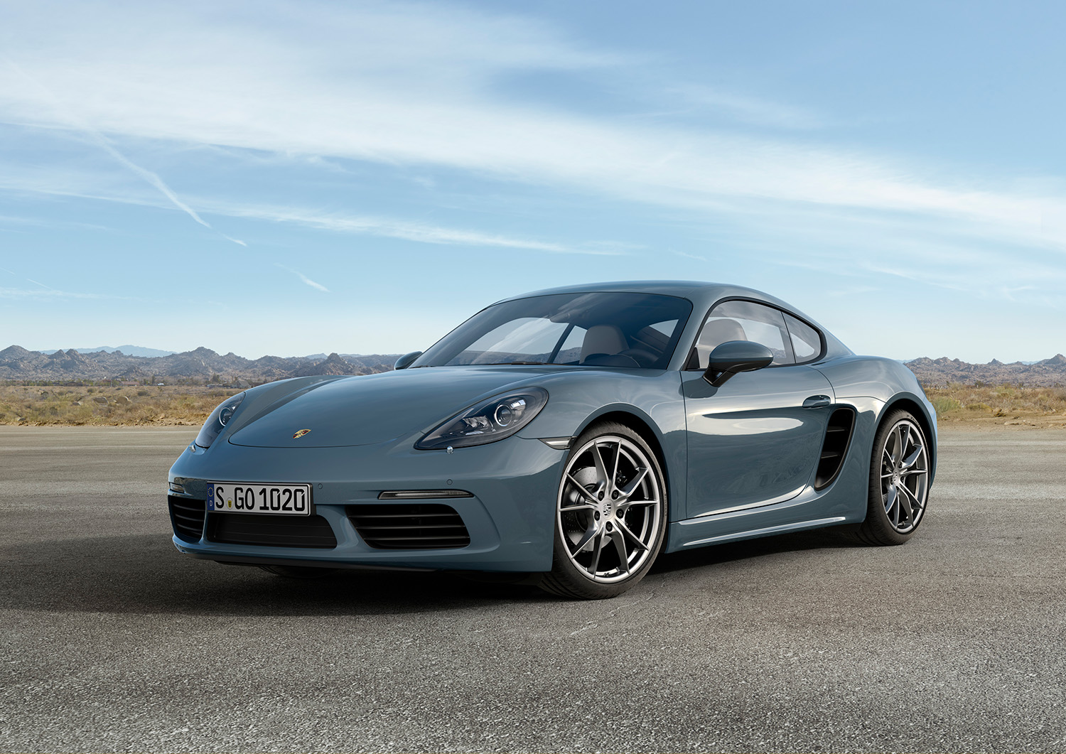 Porsche 718 Cayman in Graphite Blue paint finish displaying front driver side