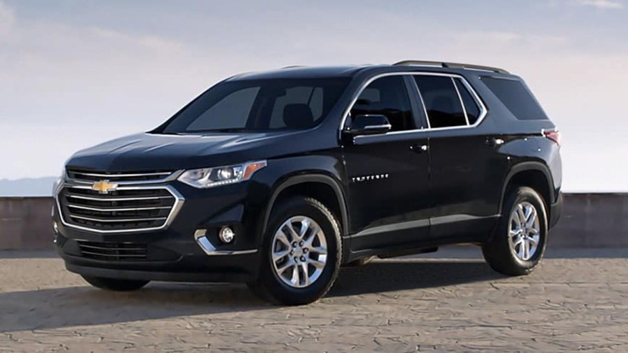Black 2022 Chevrolet Traverse posed on a road