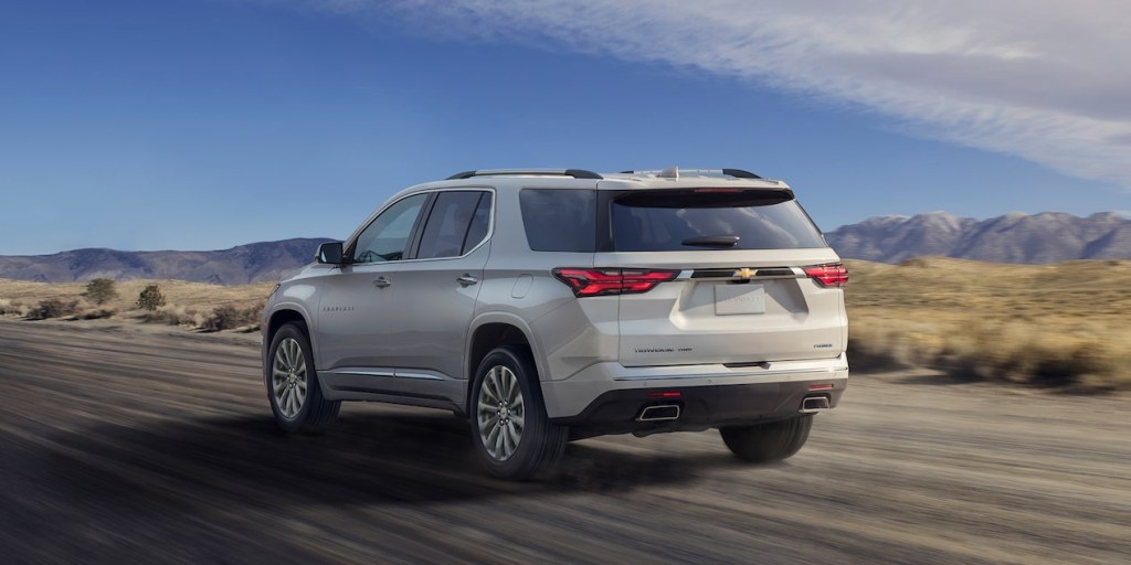 A family SUV, the Chevy Traverse is featured driving through rugged terrain.