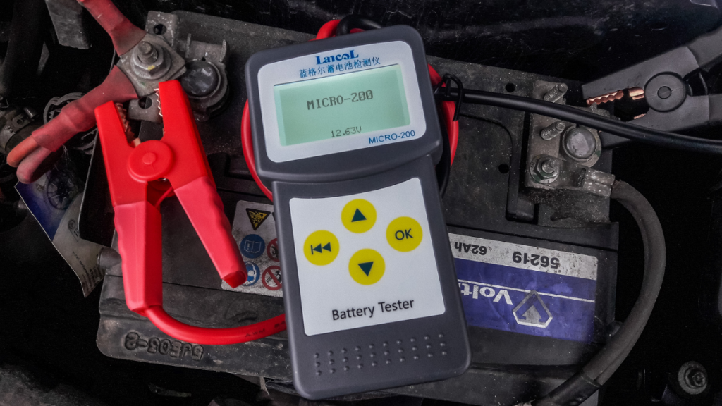 Close-up view of voltmeter on car battery, highlighting ways that you can destroy a car battery
